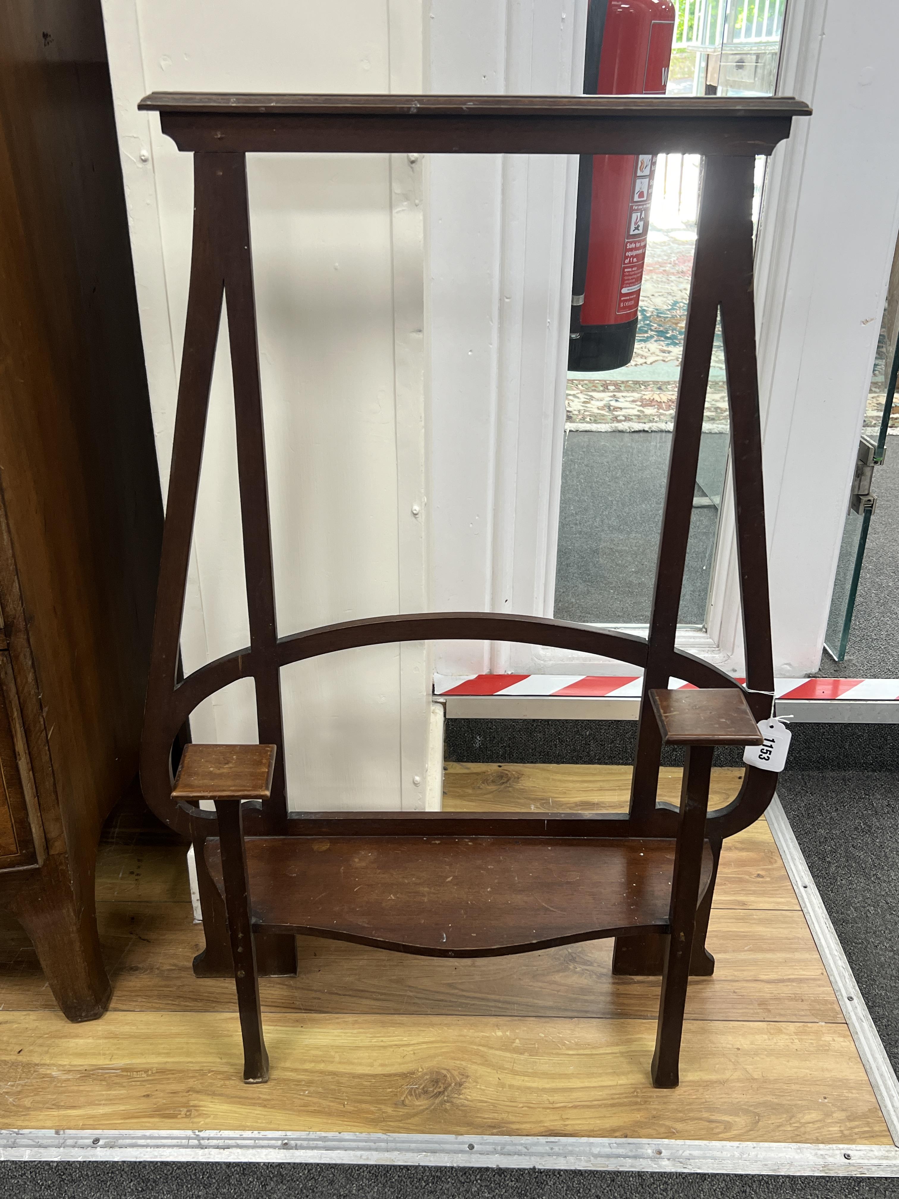 An Art Nouveau mahogany stand, width 49cm, depth 16cm, height 84cm